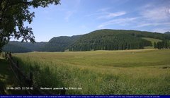 view from Webcam Cansiglio - verso la piana dei "Bech" on 2025-06-18