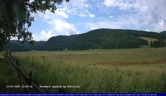 view from Webcam Cansiglio - verso la piana dei "Bech" on 2025-07-13